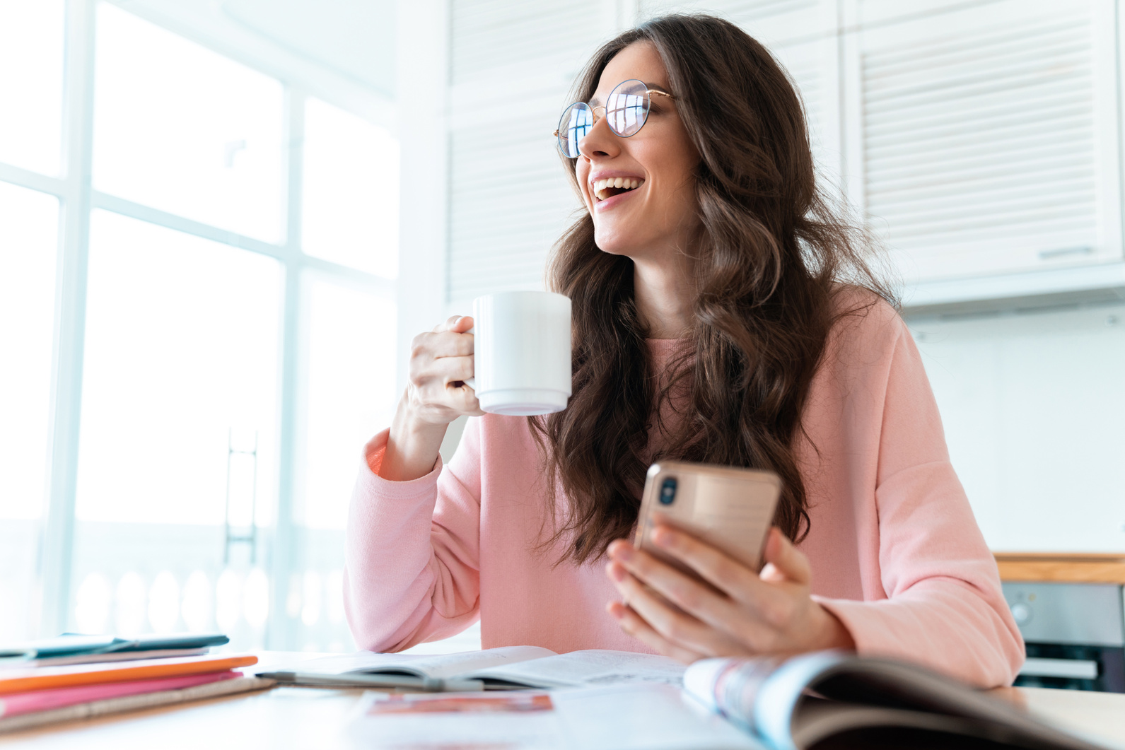Woman Drinking Coffee While Working